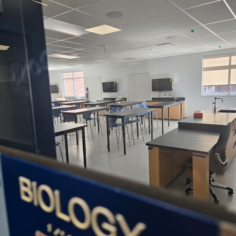 picture of new biology classroom through windows by door
