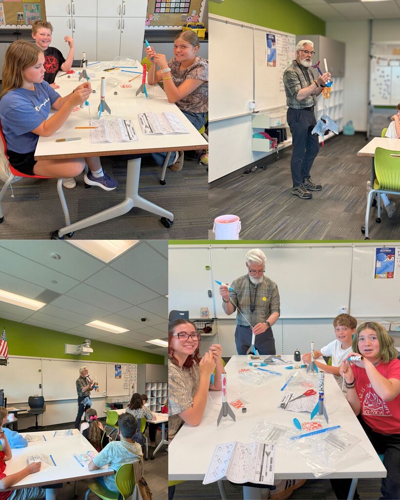 Students work together in the classroom building model rockets while guest instructor Kurt Gentry demonstrates rocket science concepts and launch preparation during the 6th grade STEM unit.