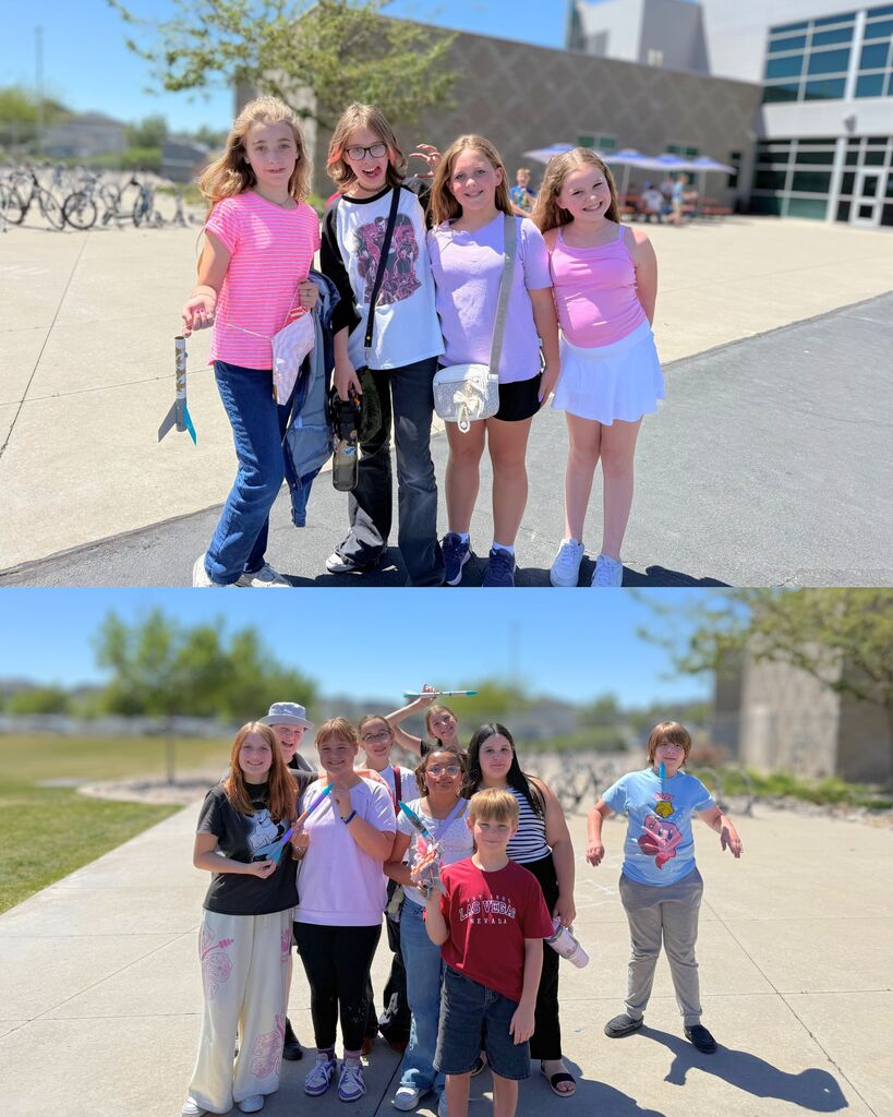 Several groups of 6th graders pose outside with their colorful model rockets during the school’s STEM rocket launch activity. Students smile together in the sunshine while showing off their completed rockets.