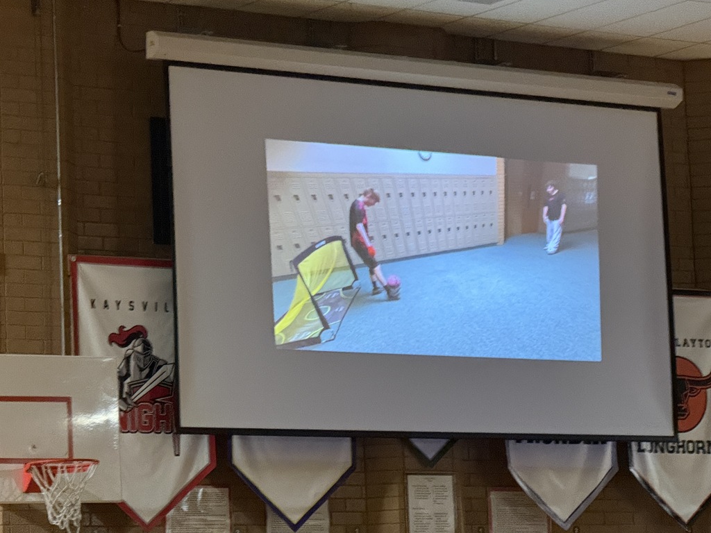 Video of student playing soccer for assembly. 