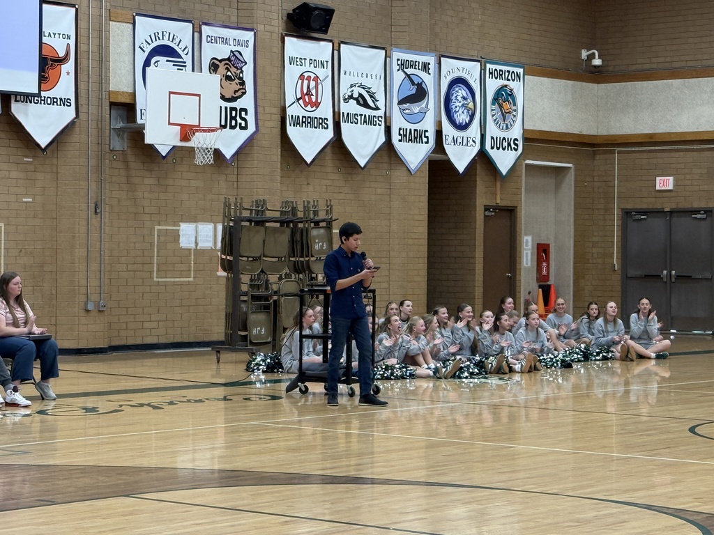 Student singing a solo for the talent assembly. 