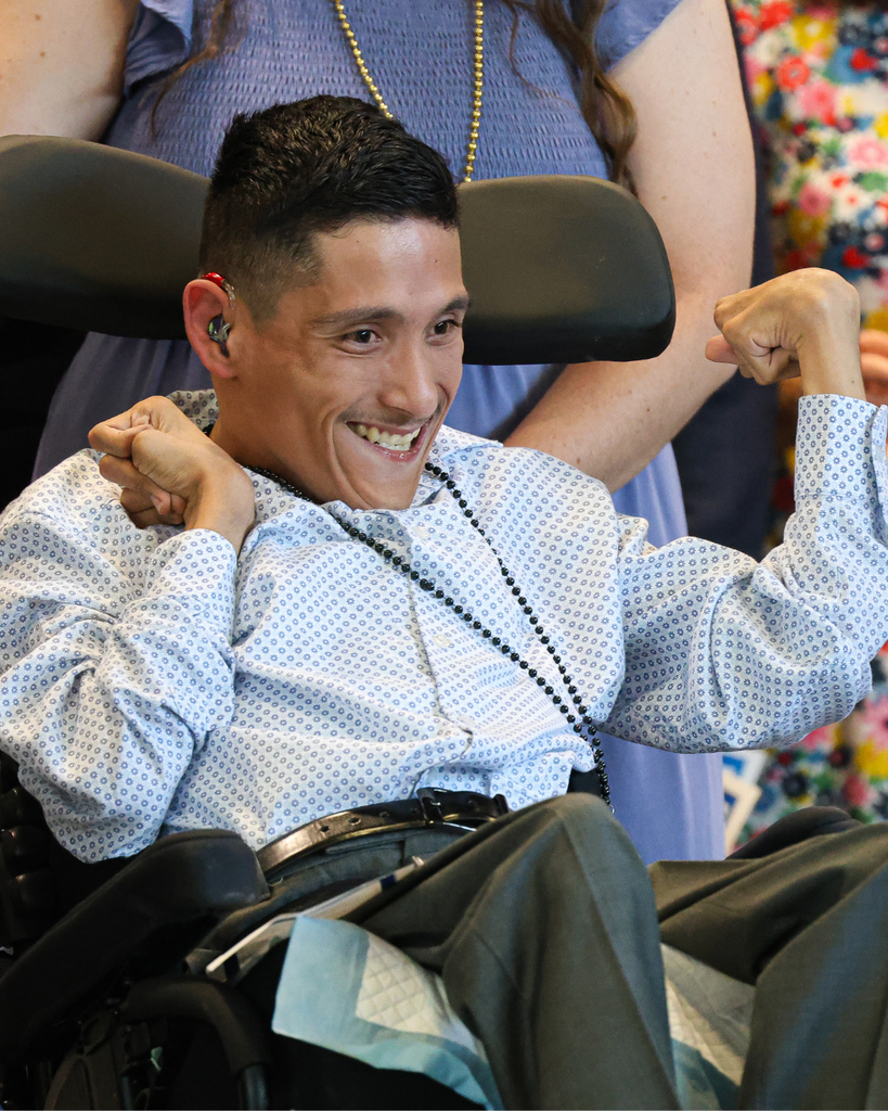 A Vista Education Campus graduate smiles. 