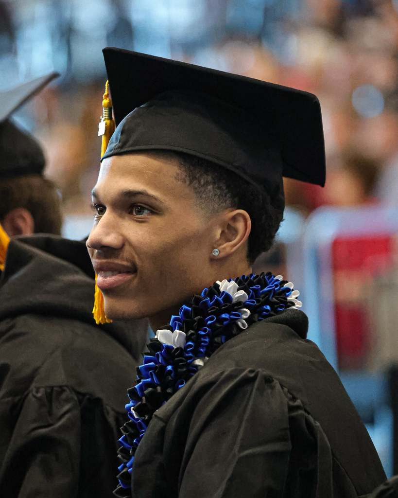 Davis Adult Education graduate smiling to the left.