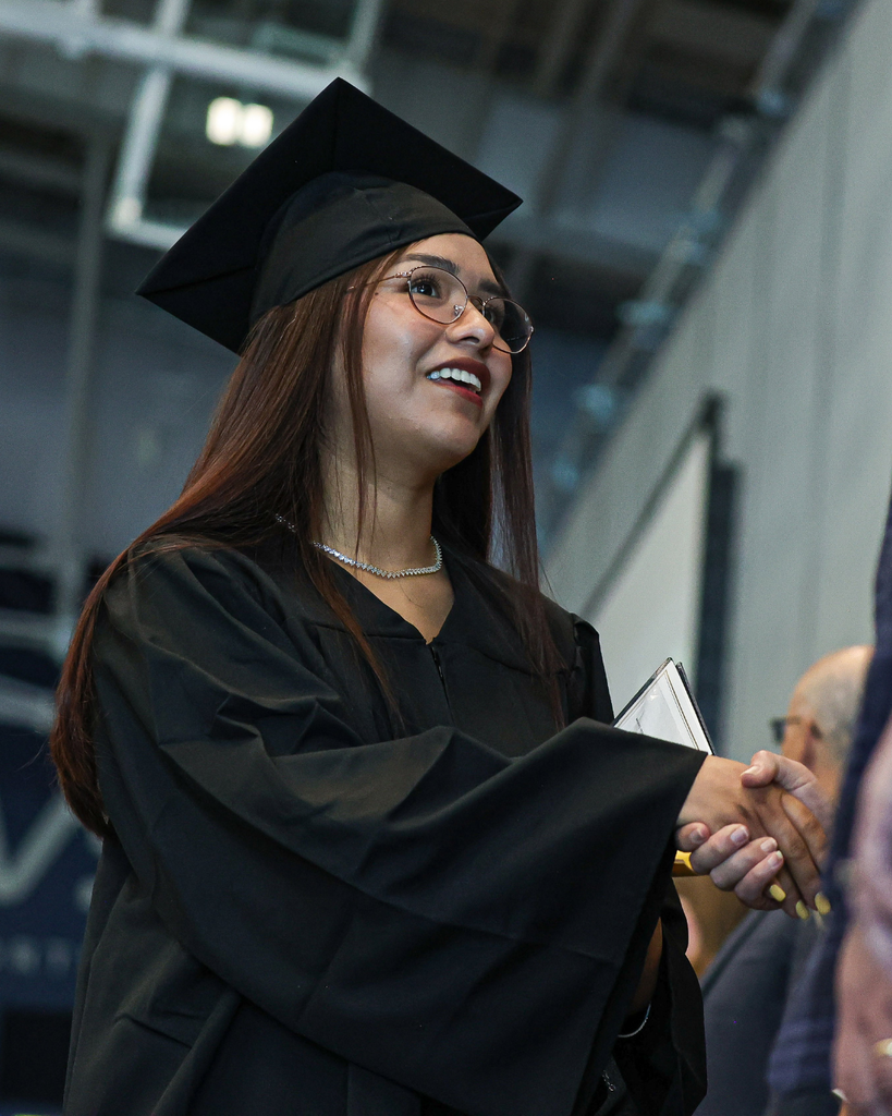 Davis Adult Education graduate shaking hands. 