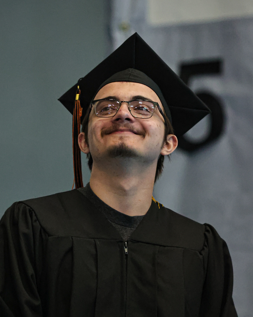 Davis Adult Education graduate smiling up. 