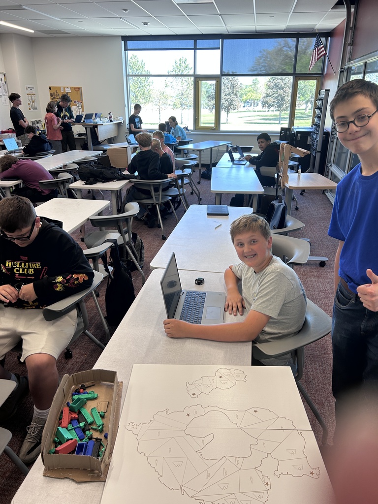 Students pose with their game boards.