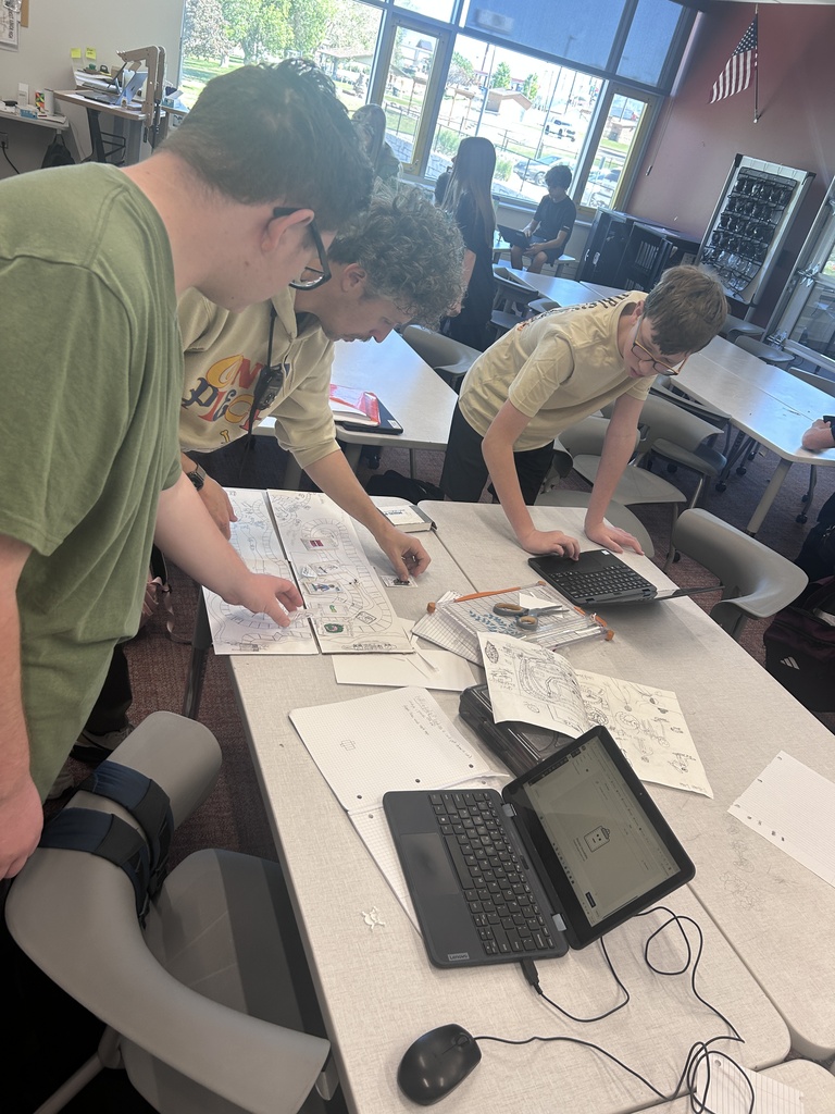 Students pose with their game boards.