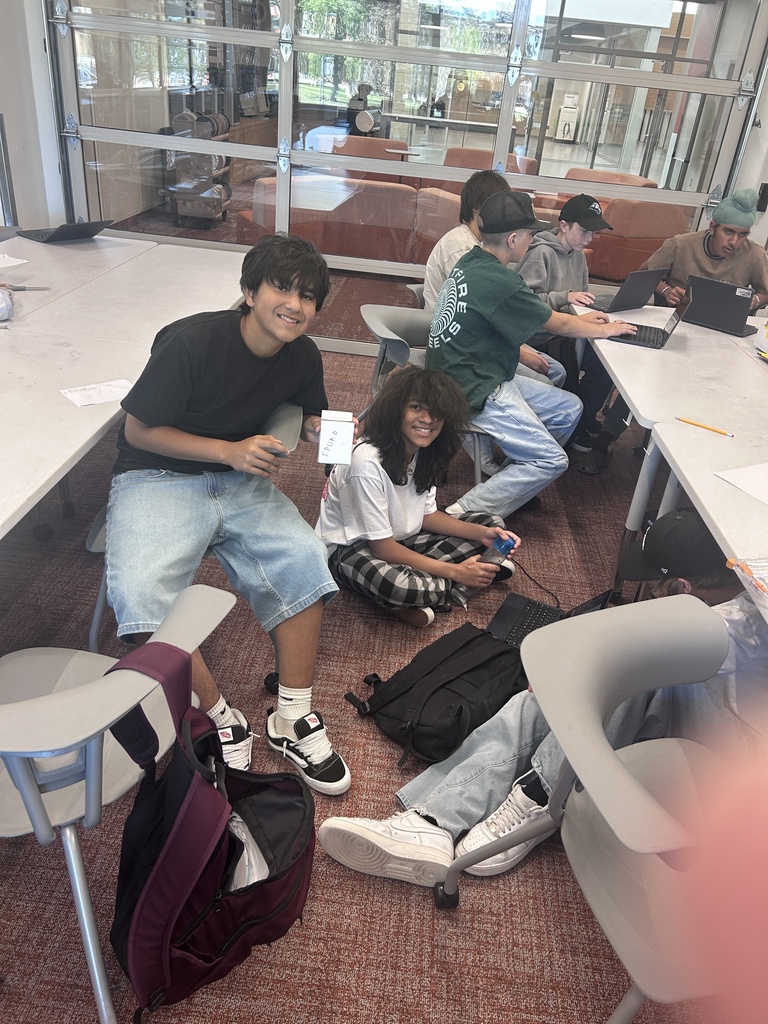 Students pose with their game boards.