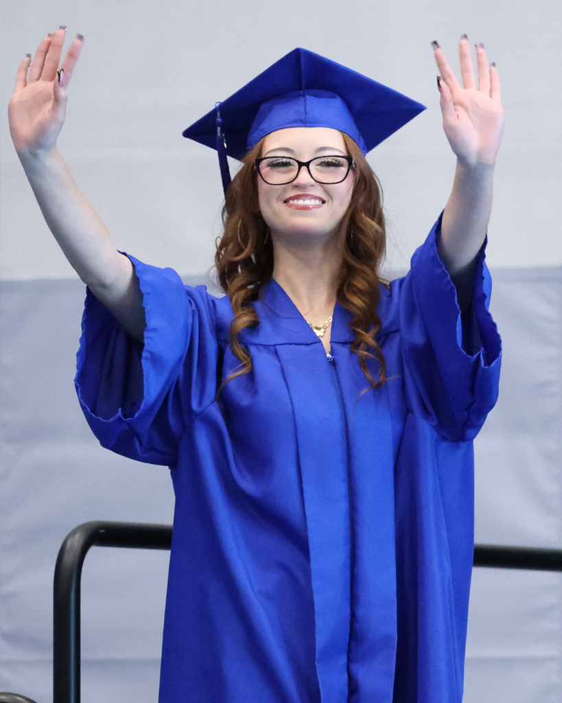 A Mountain High graduate waving to the crowd. 