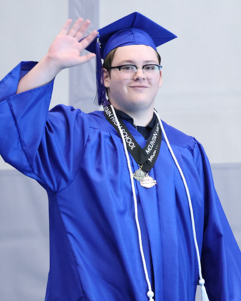 A Mountain High graduate waving to the crowd. 