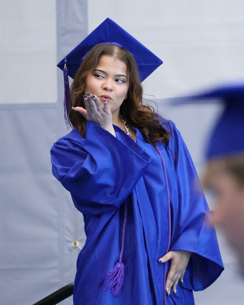 A Mountain High graduate blowing a kiss. 