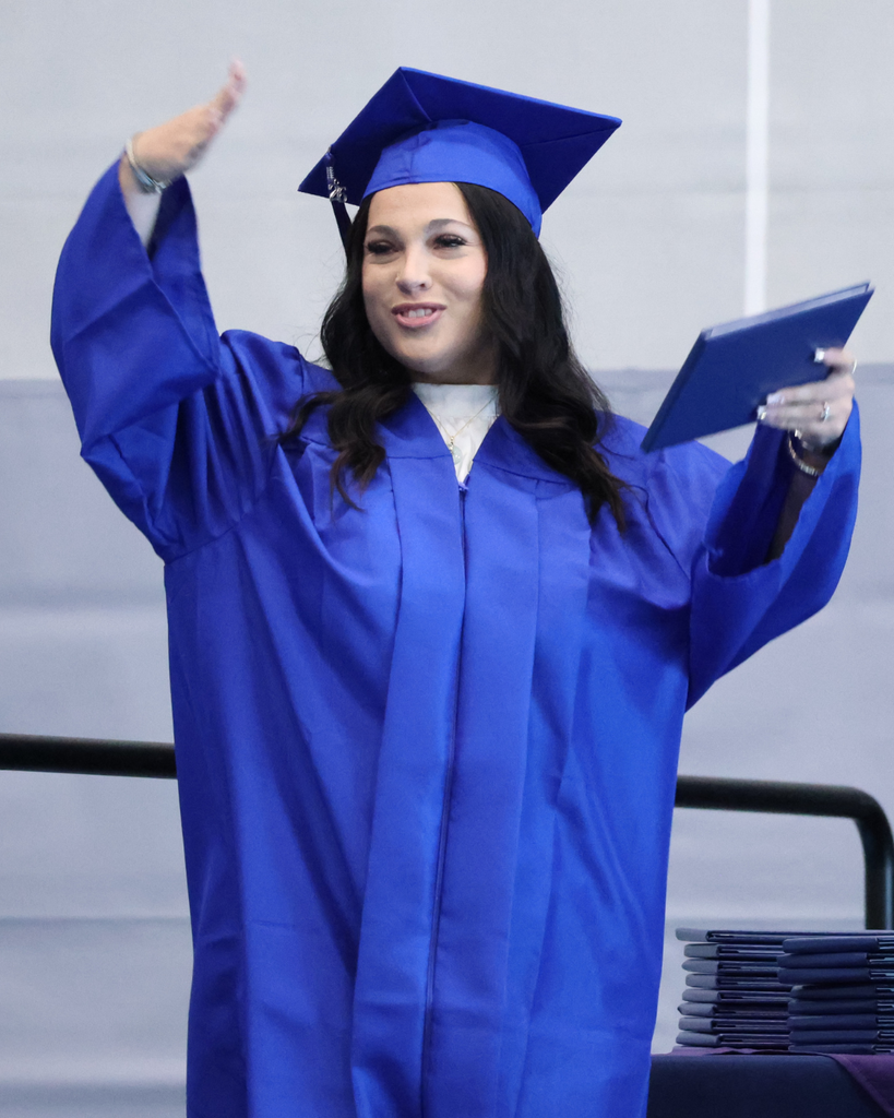 A Mountain High graduate smiling. 