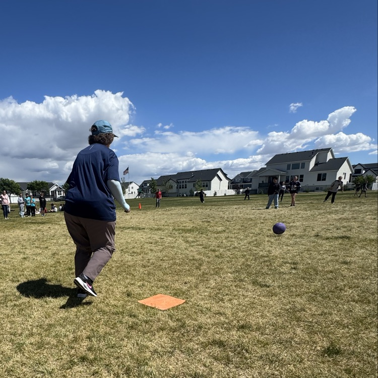 teacher kicking the kickball
