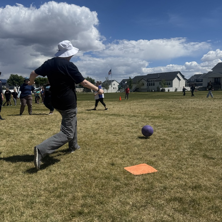 teacher kicking the kickball
