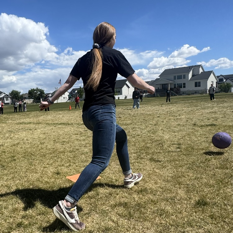 teacher kicking the kickball
