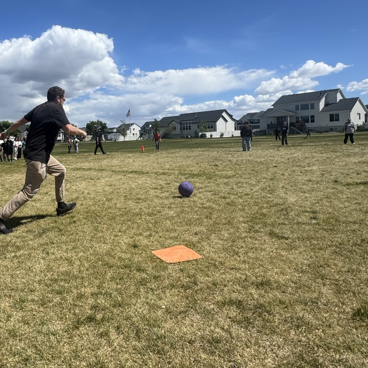 teacher kicking the kickball