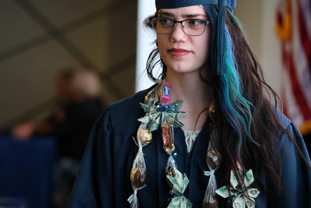 A Davis Connect graduate looking to the right. 