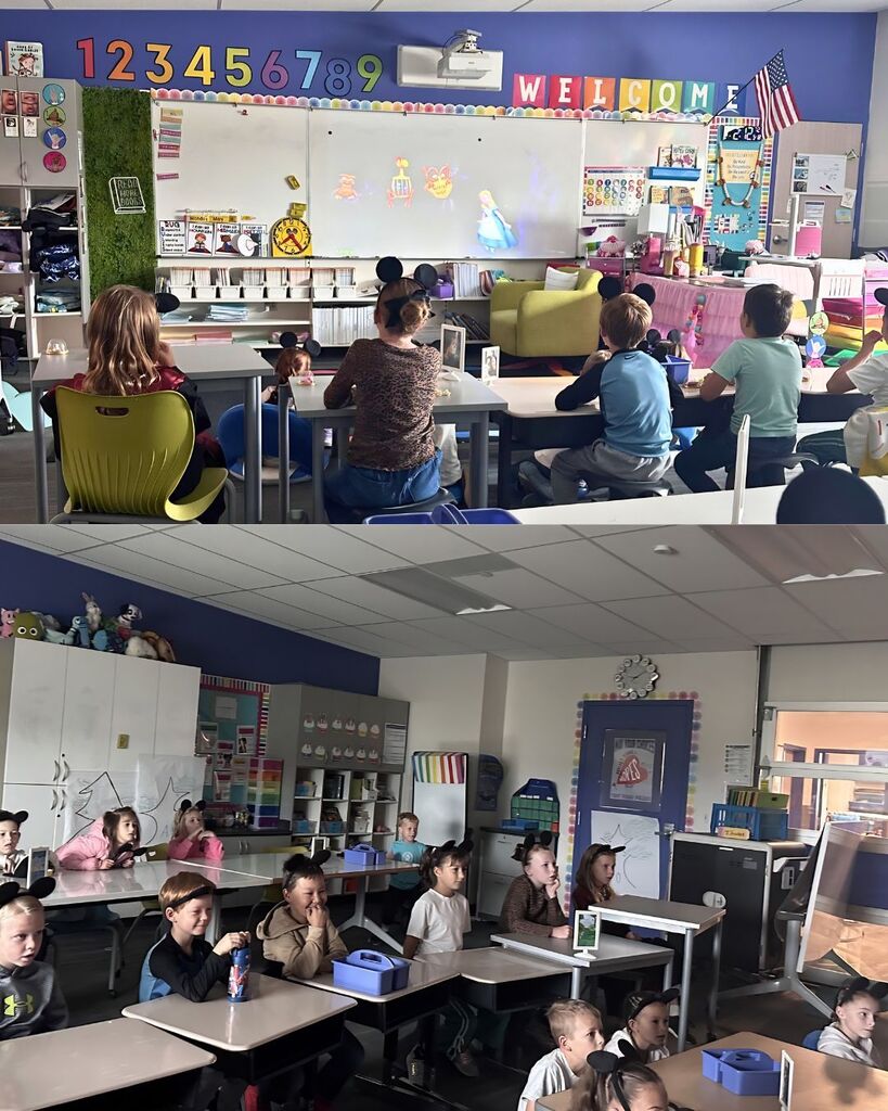 Students wearing Mickey ears sit at their desks watching a Disney movie projected at the front of the classroom. The classroom lights are dimmed, creating a cozy movie day atmosphere while students watch quietly from their seats.