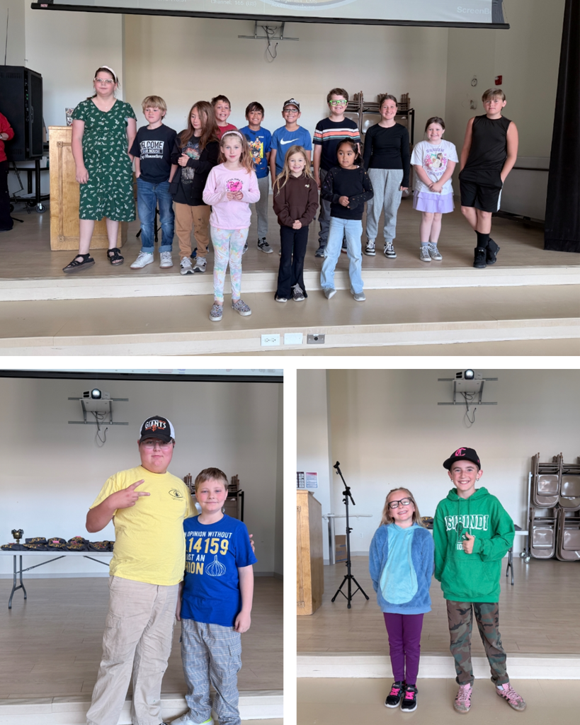 A three-panel photo collage of elementary students on a school stage.Top: A large group of twelve diverse elementary school students stand together in a line across the stage, smiling for the camera.Bottom left: A boy in a yellow shirt and Giants baseball cap stands next to a boy in a blue shirt with a Pi symbol ($3.14159$) on it.Bottom right: A young girl in glasses and a fuzzy blue hoodie stands next to an older boy wearing a green "Isibindi" hoodie and a baseball cap.