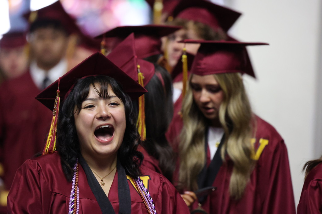 A Viewmont High graduate smiles happily. 