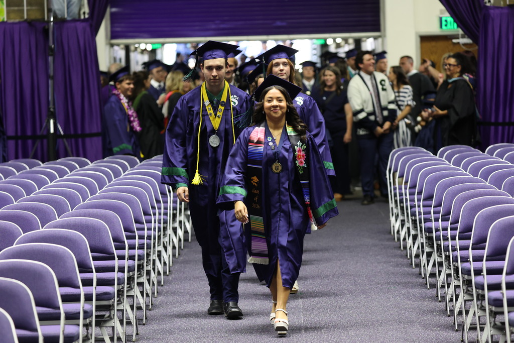 Syracuse High graduates walking into the Dee Events Center.