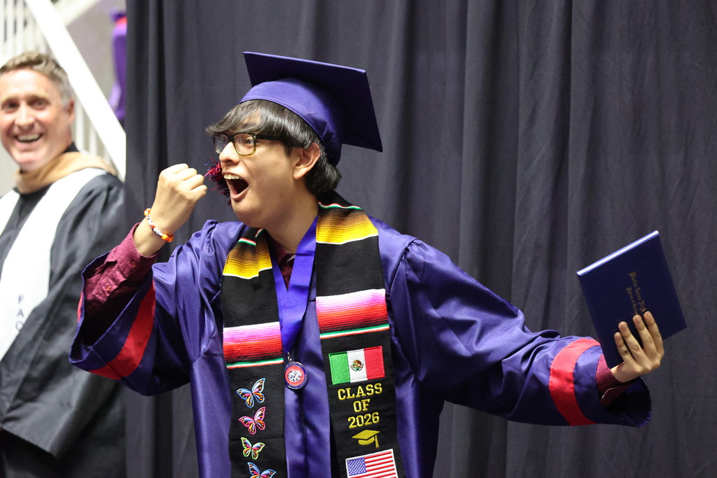 A Woods Cross graduate looks surprised during graduation.