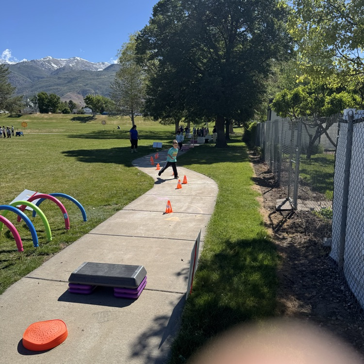 Kids running an obstacle course  