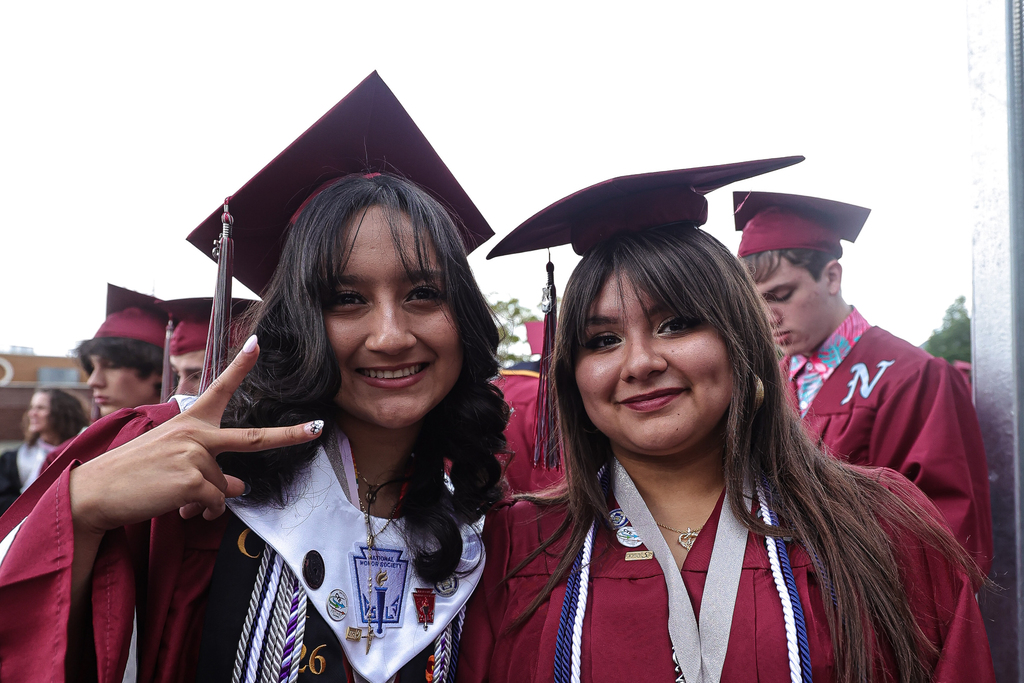 Northridge High graduates smile at the camera. 