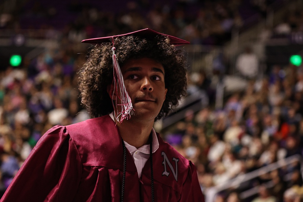 A Northridge High graduate walks during graduation.