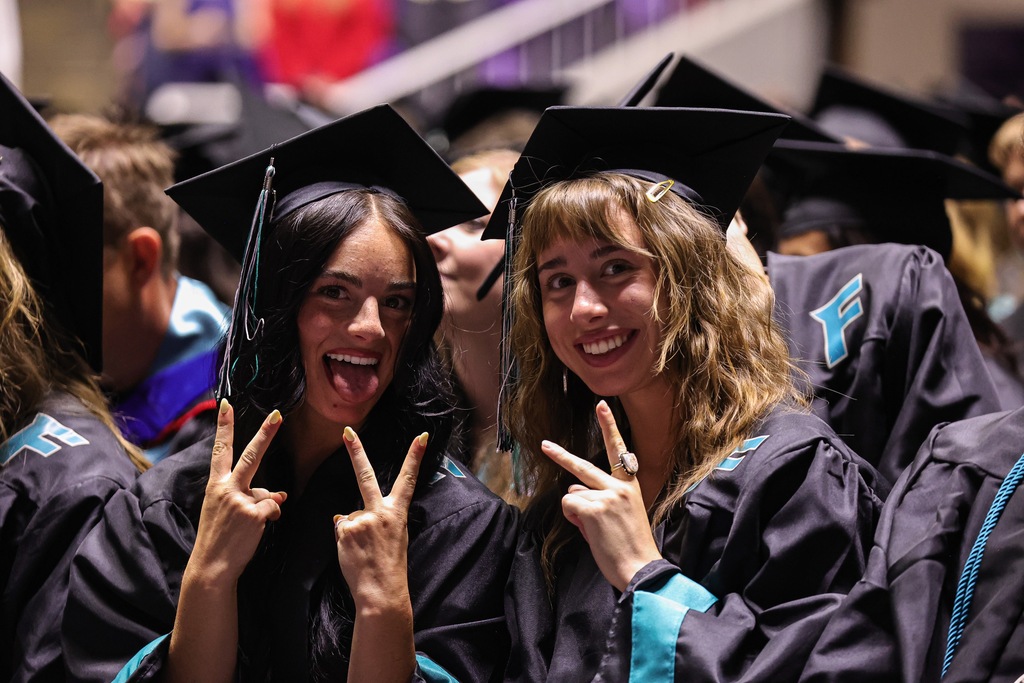 Farmington High graduates pose during graduation.