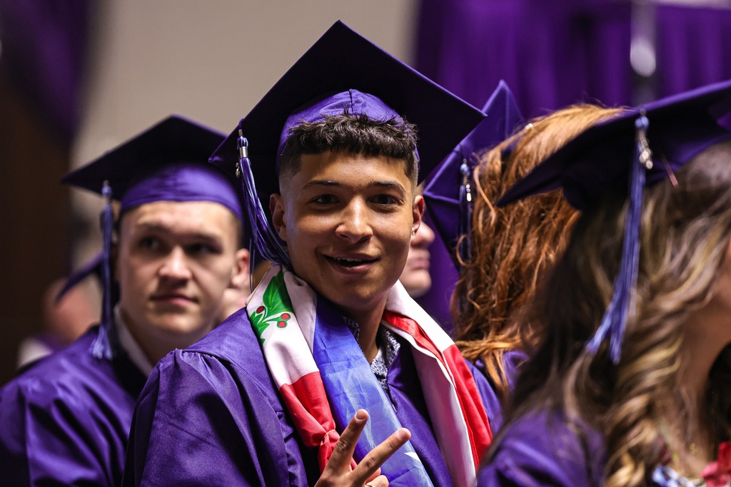 Layton High graduate smiling at the camera.