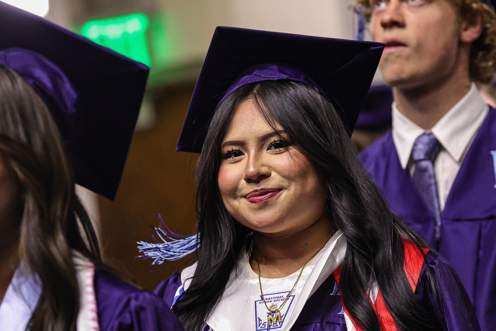 Layton High graduate smiling at the camera.