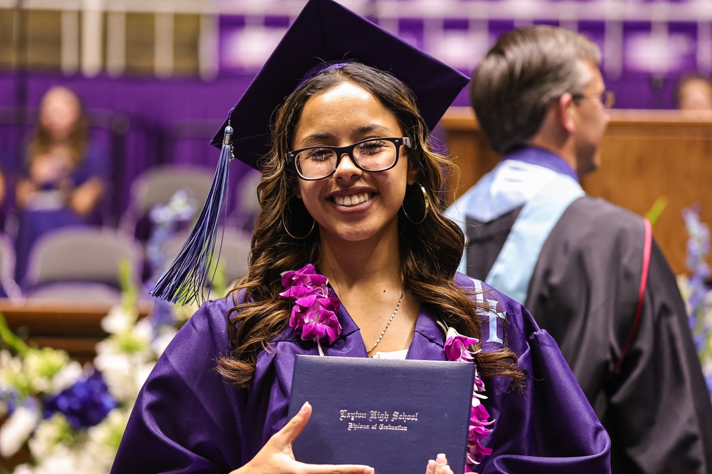 Layton High graduate smiling at the camera.