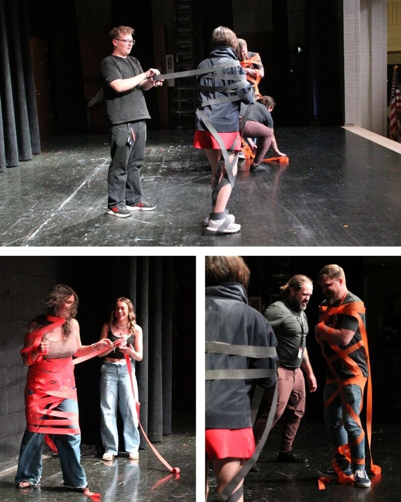 Students and teachers competing in wrapping others in streamers like a mummy