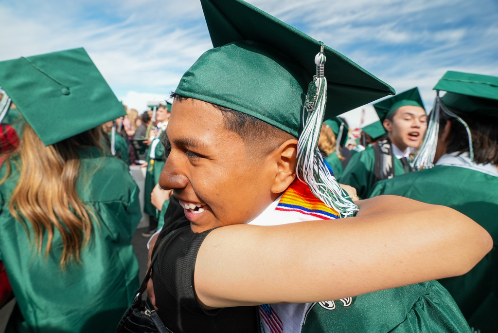 Clearfield High graduate hugging a family member.