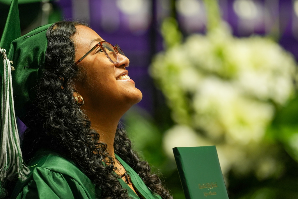 Clearfield High graduate smiles up to the crowd.