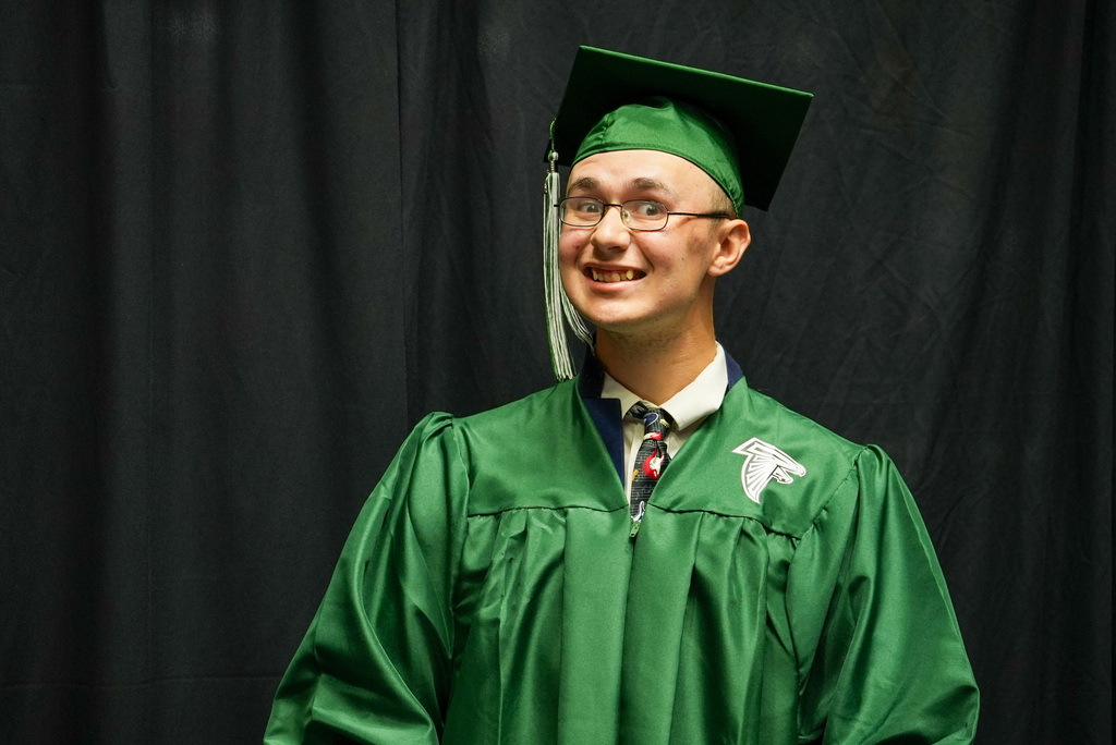 Clearfield High graduate smiles at the camera.