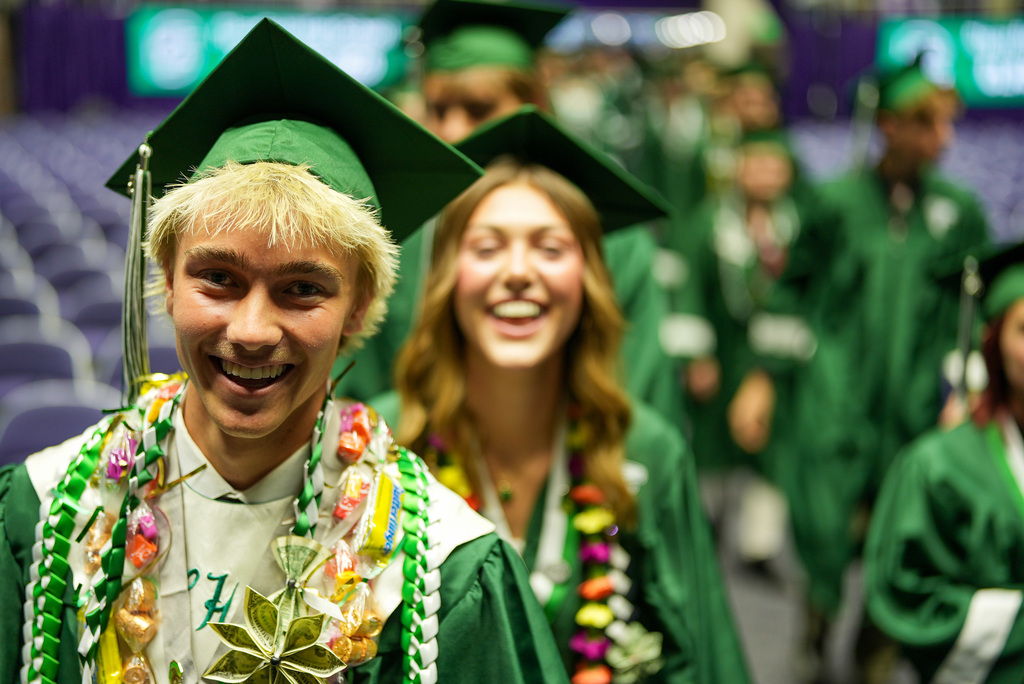 Clearfield High graduate smiles at the camera.