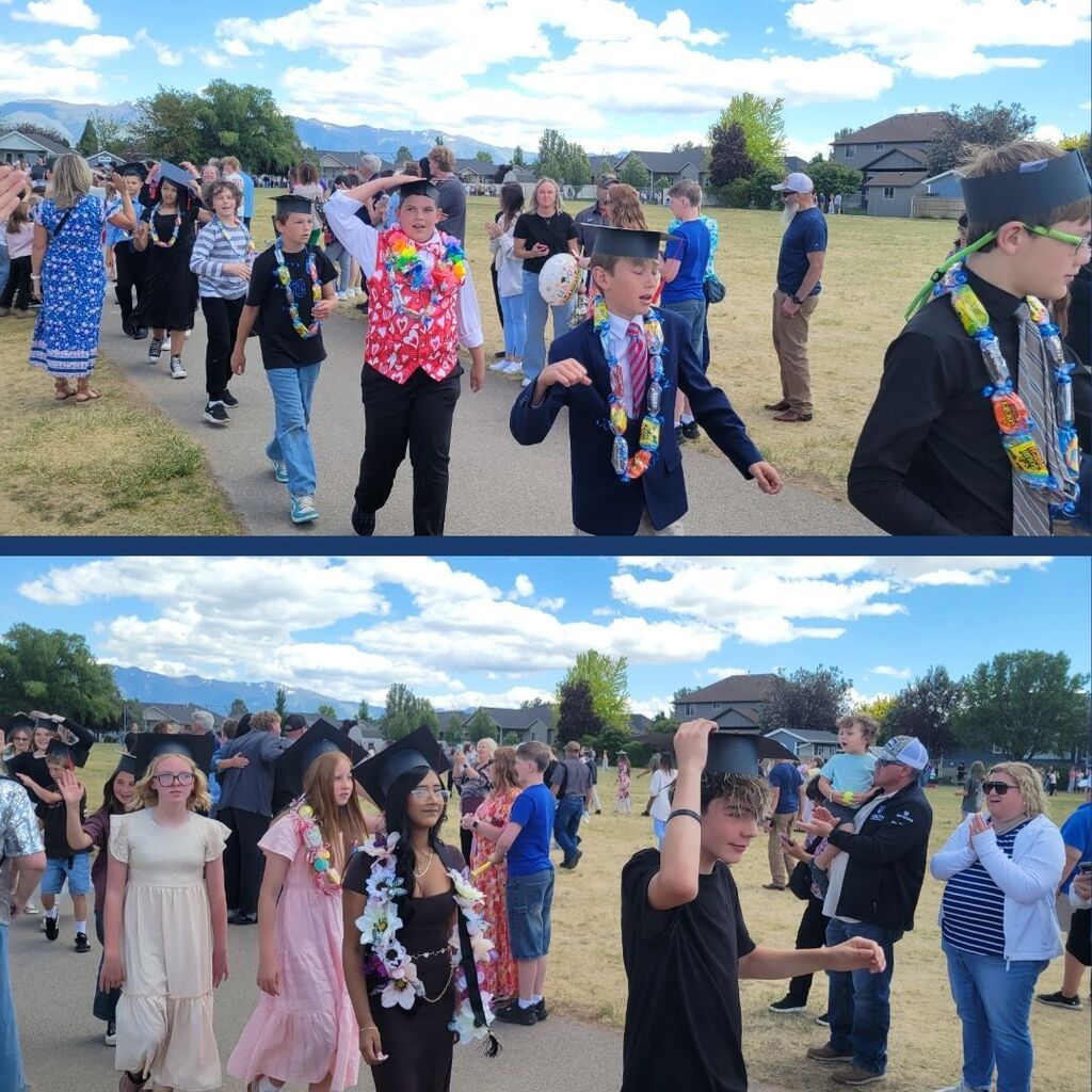 6th grade students walk around the track wearing paper graduation caps.