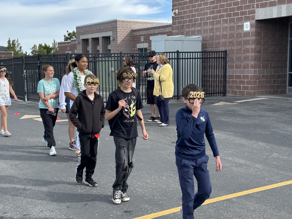 sixth graders walking in the grad parade