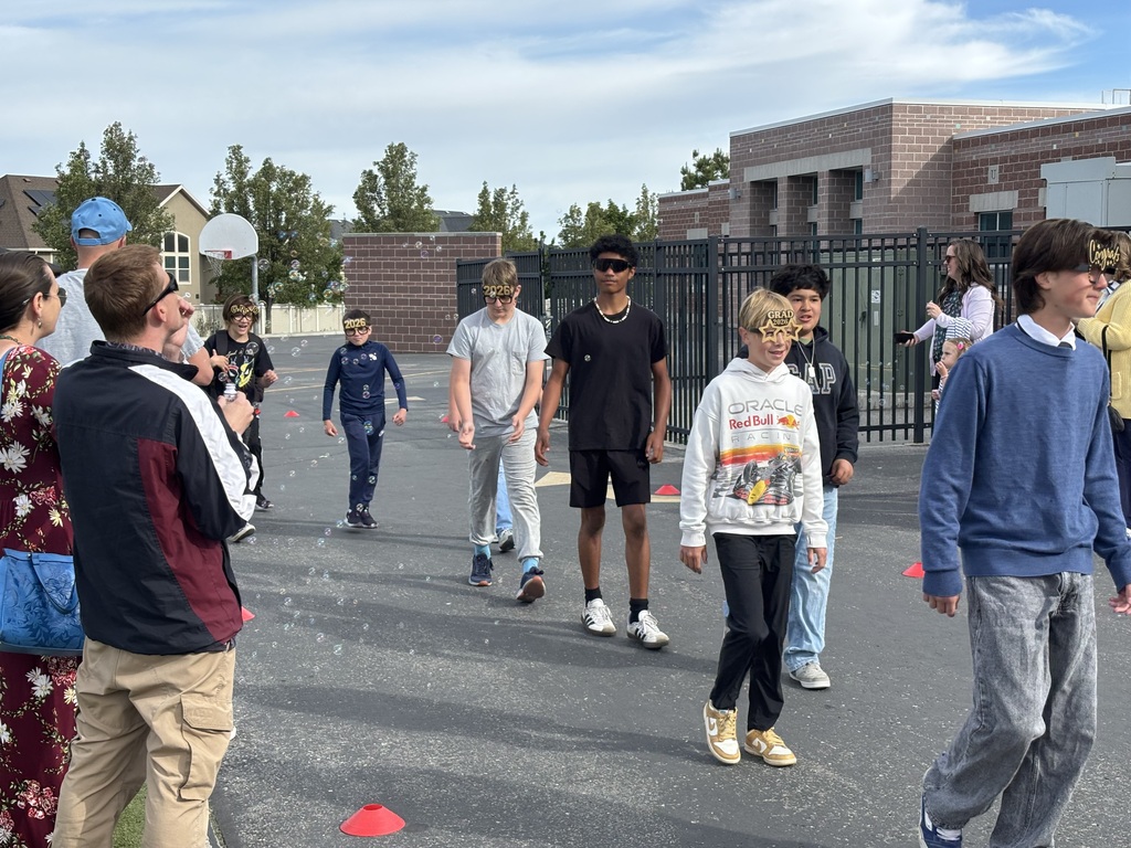 sixth graders walking in the grad parade