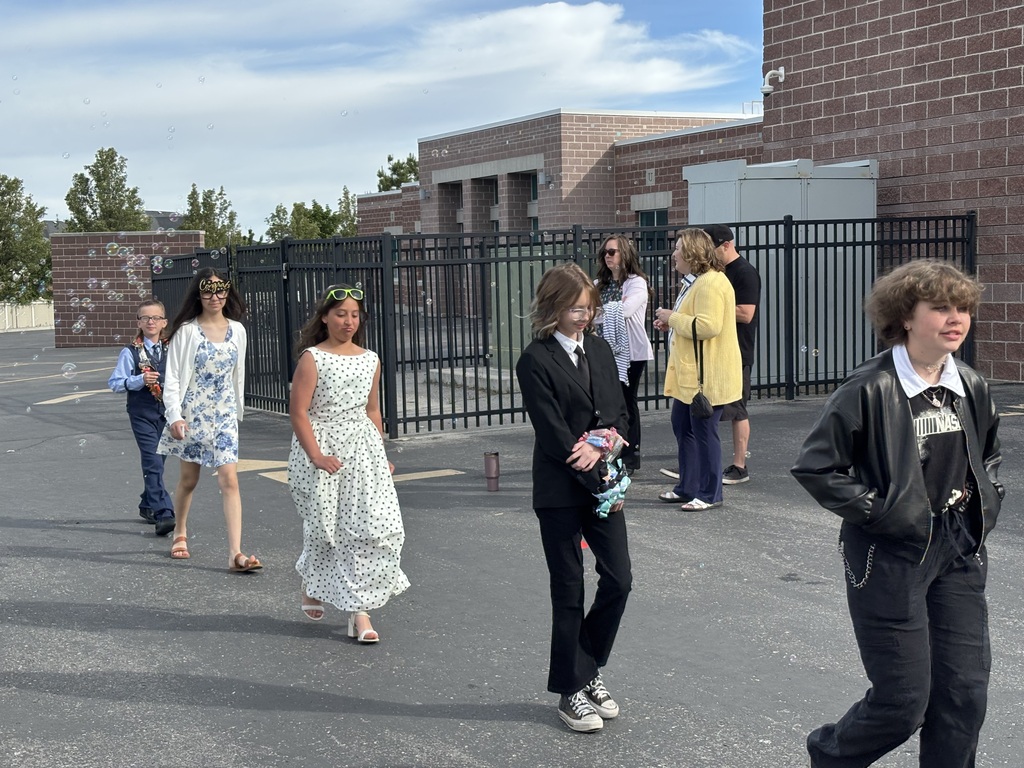 sixth graders walking in the grad parade