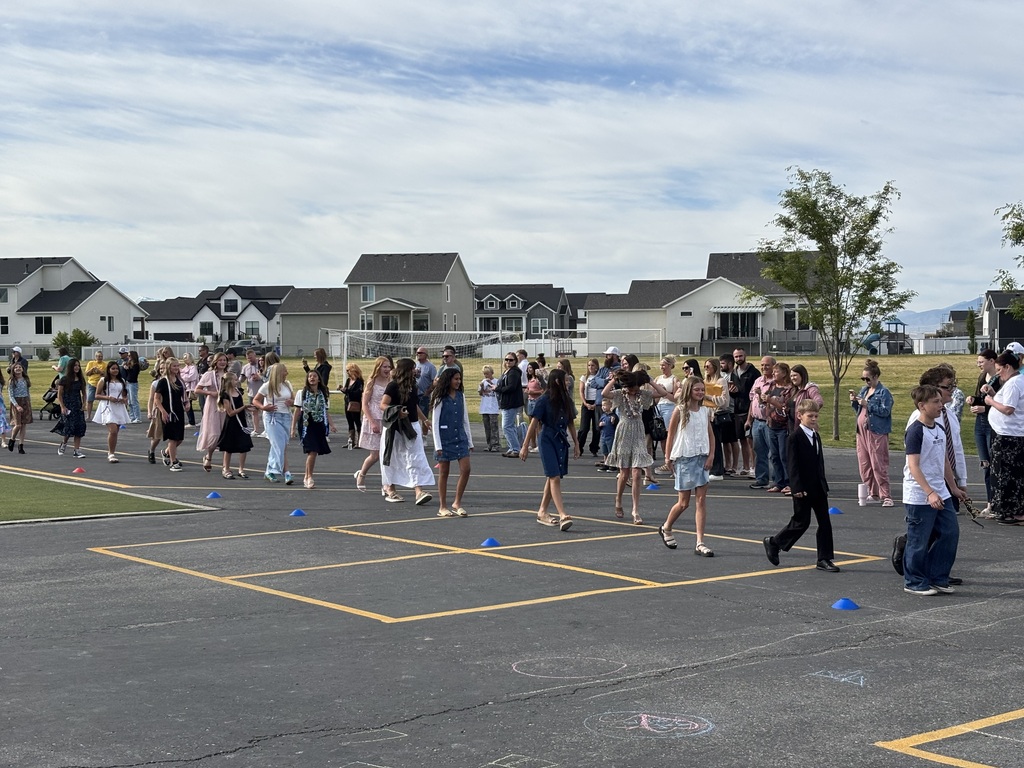 sixth graders walking in the grad parade