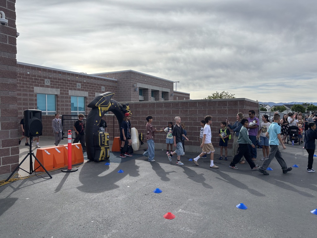 sixth graders walking in the grad parade