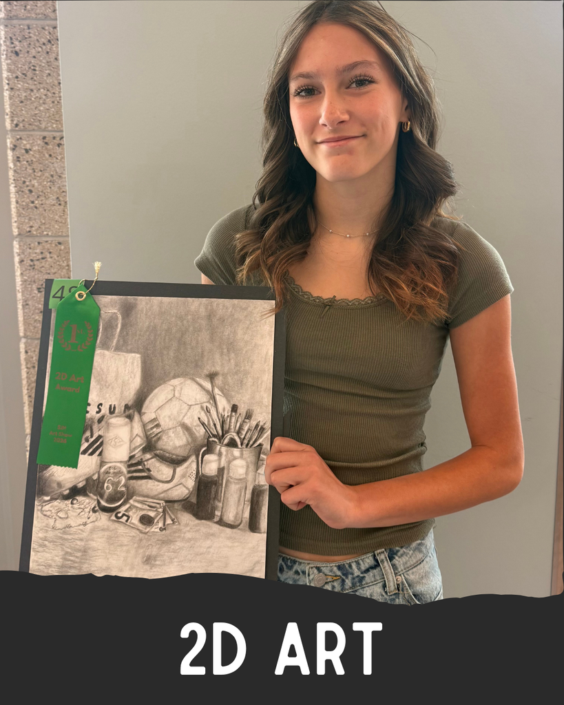 Student holding artwork.