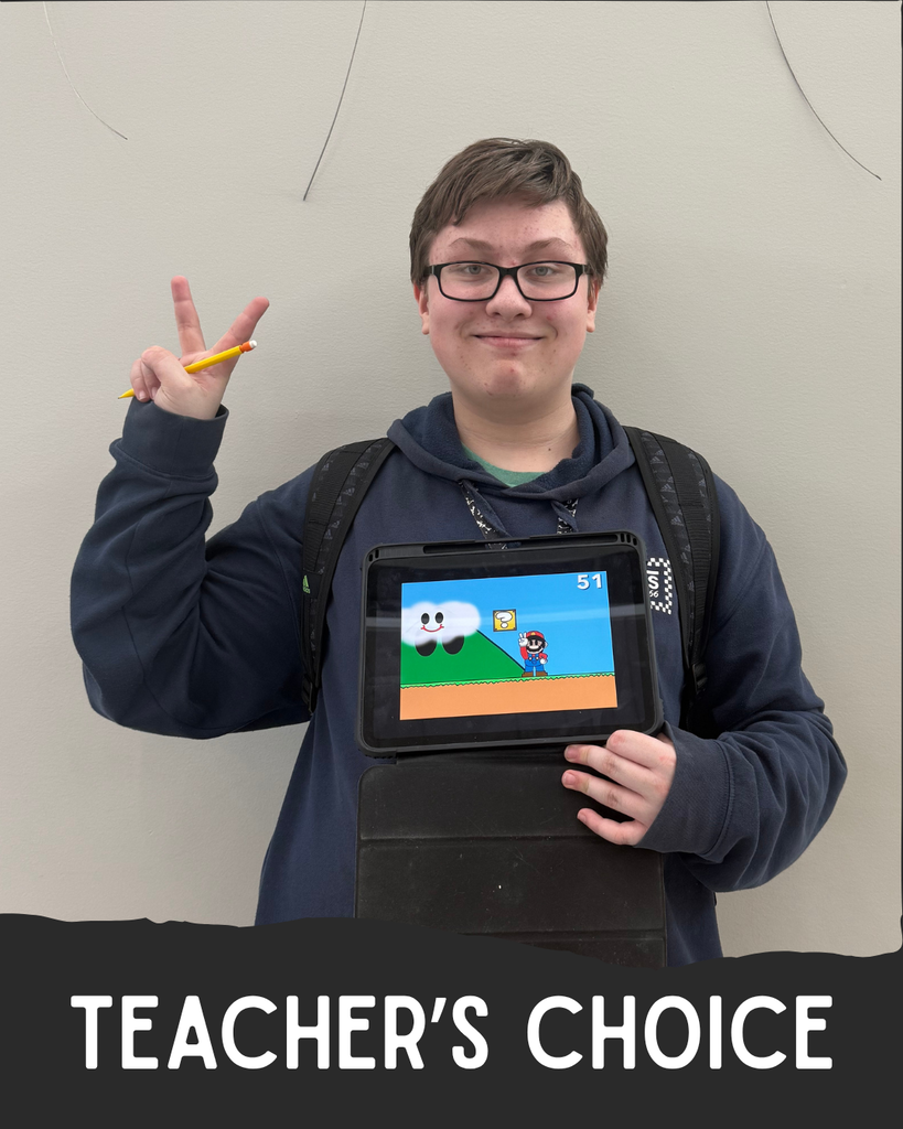 Student holding artwork.