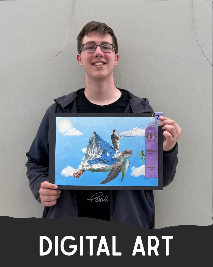 Student holding artwork.