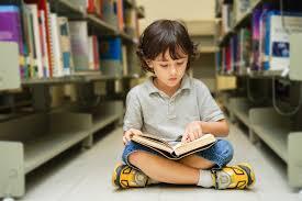 Child reading in a library