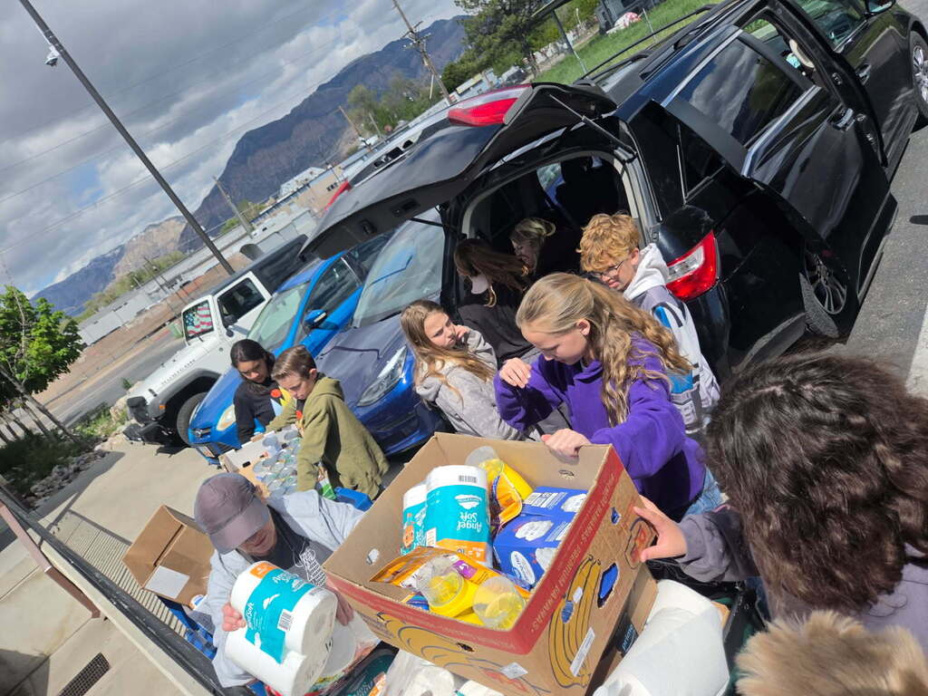 Students unloading a car.