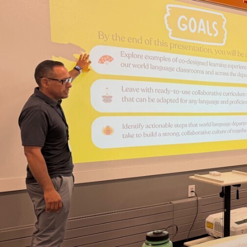 Mr Gastellum teaching other teachers at a white board